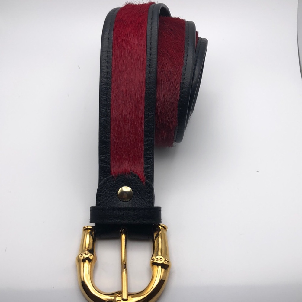 Calf hair (red color) belt.  Black leather. Gold tone buckle. Waist 38”/42”